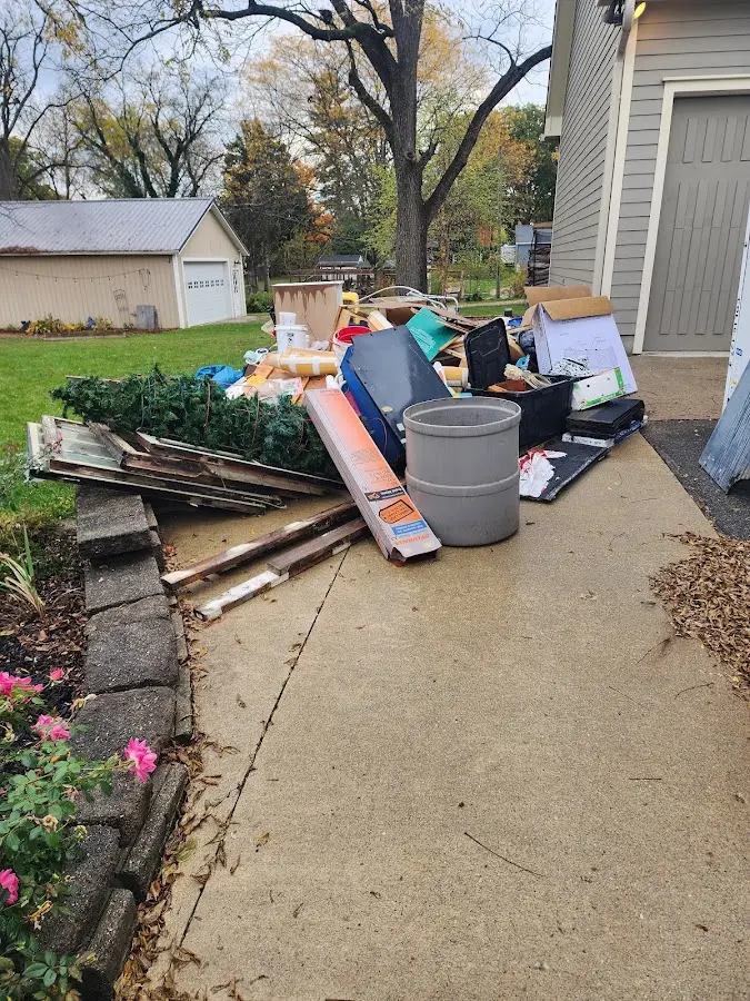 Dumpster being loaded with debris for Demolition Dumpster Rental in Portland